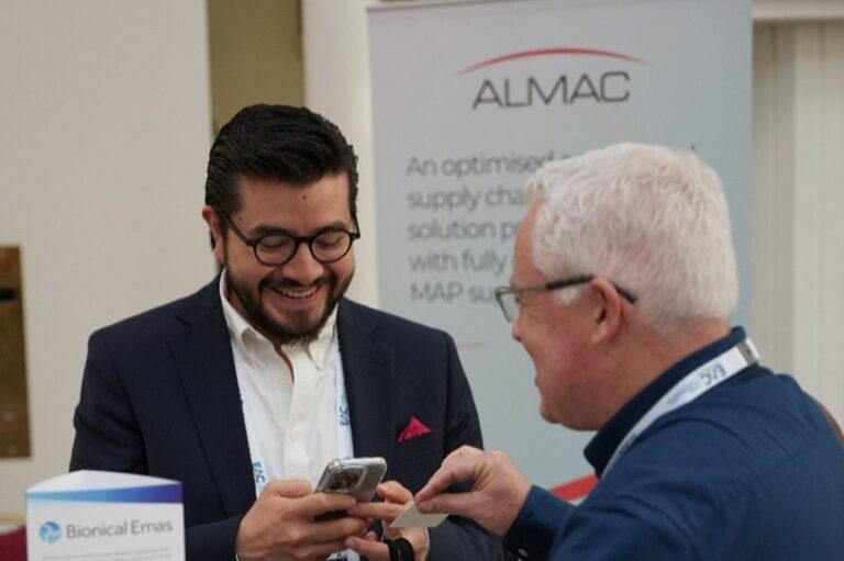 Conference attendees networking with clinical research and patient recruitment solution providers at a healthcare event
