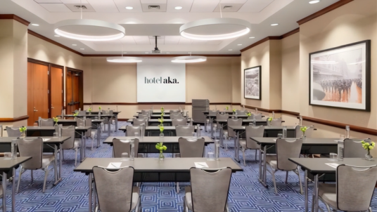 Hotel AKA conference meeting room prepared for patient recruitment, clinical trial, healthcare, and life sciences events