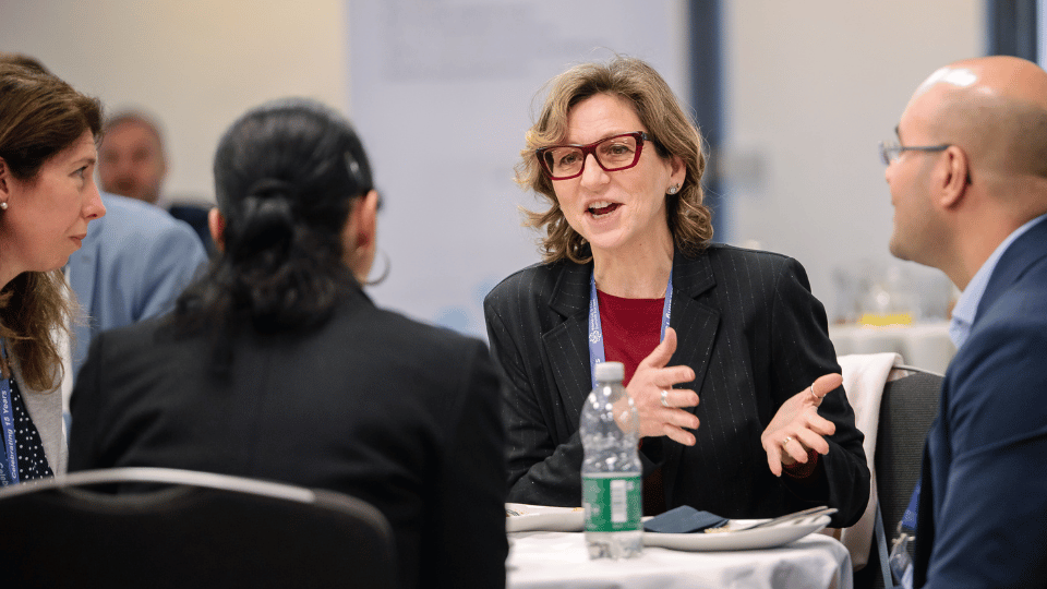 Healthcare and clinical research professionals networking during a patient recruitment and clinical trial strategy discussion